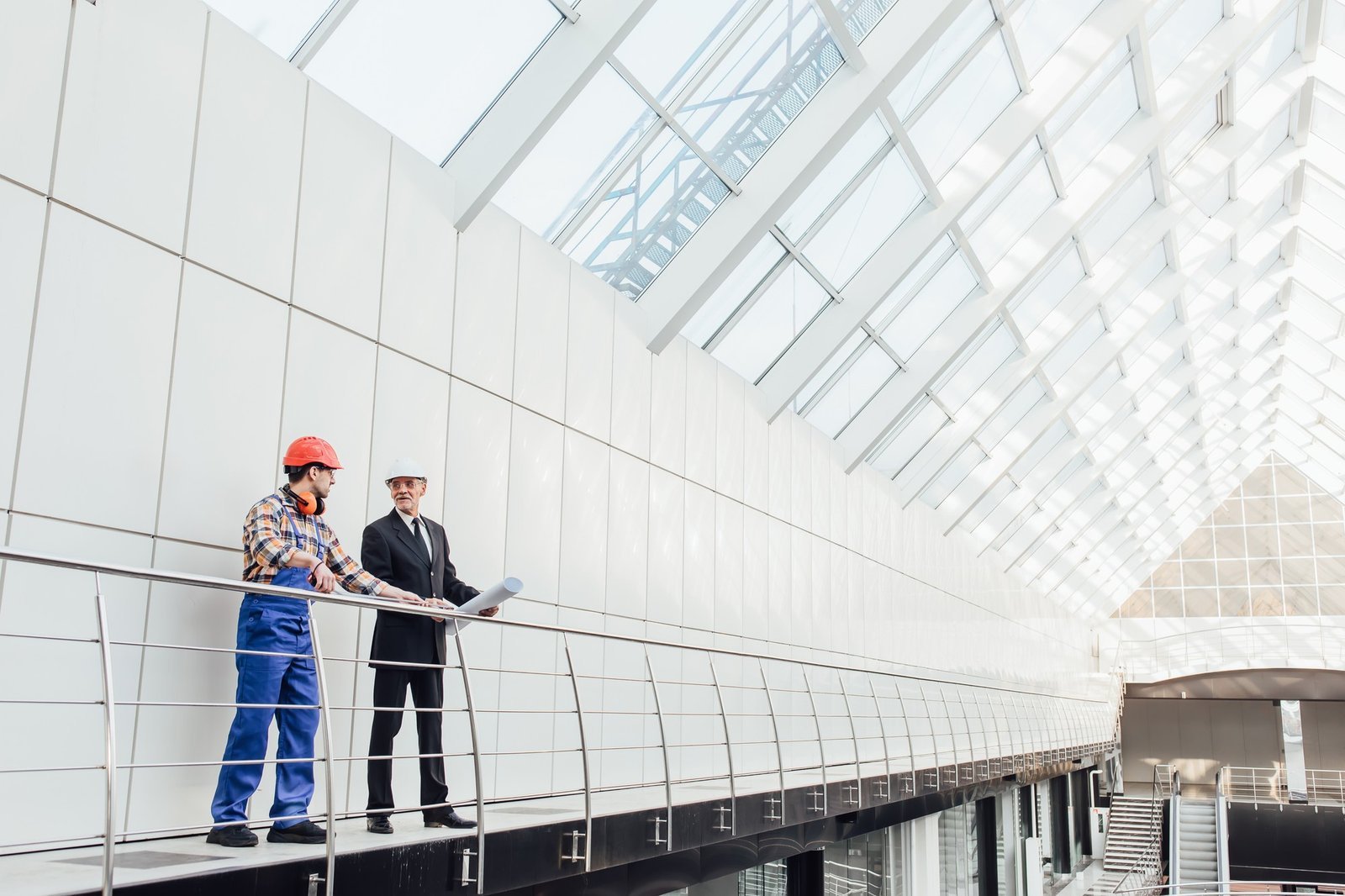 standing-industrial-engineers-blue-vests-helmets.jpg